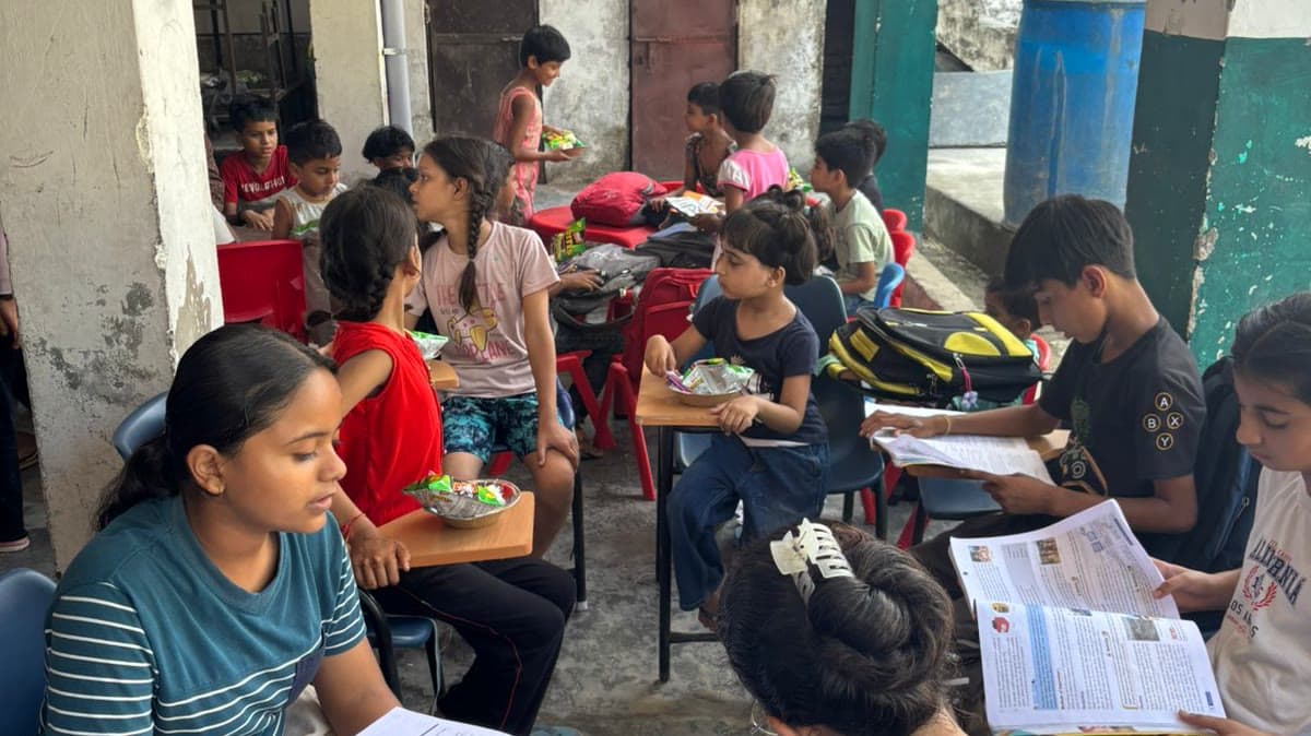 An open-air Dreamwings class running in a village courtyard